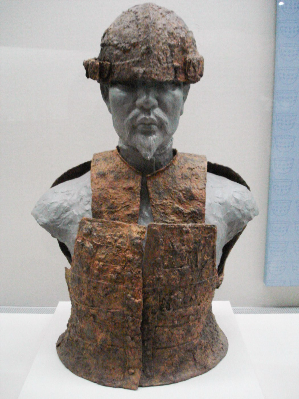 Museum replica of 5th-century Gaya armour and helmet excavated at Goryeong, shown on a figure at the Gimhae National Museum. It shows how the plate cuirass, neck guard and helmet sat on the body.
