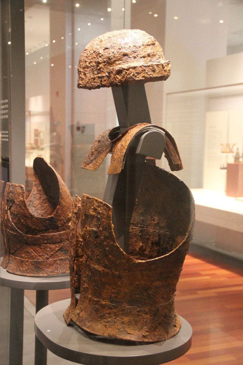 Iron plate cuirass with helmet and neck guard in the Gaya gallery of the National Museum of Korea. Gaya, rich in iron, buried warriors with riveted plate armour like this.