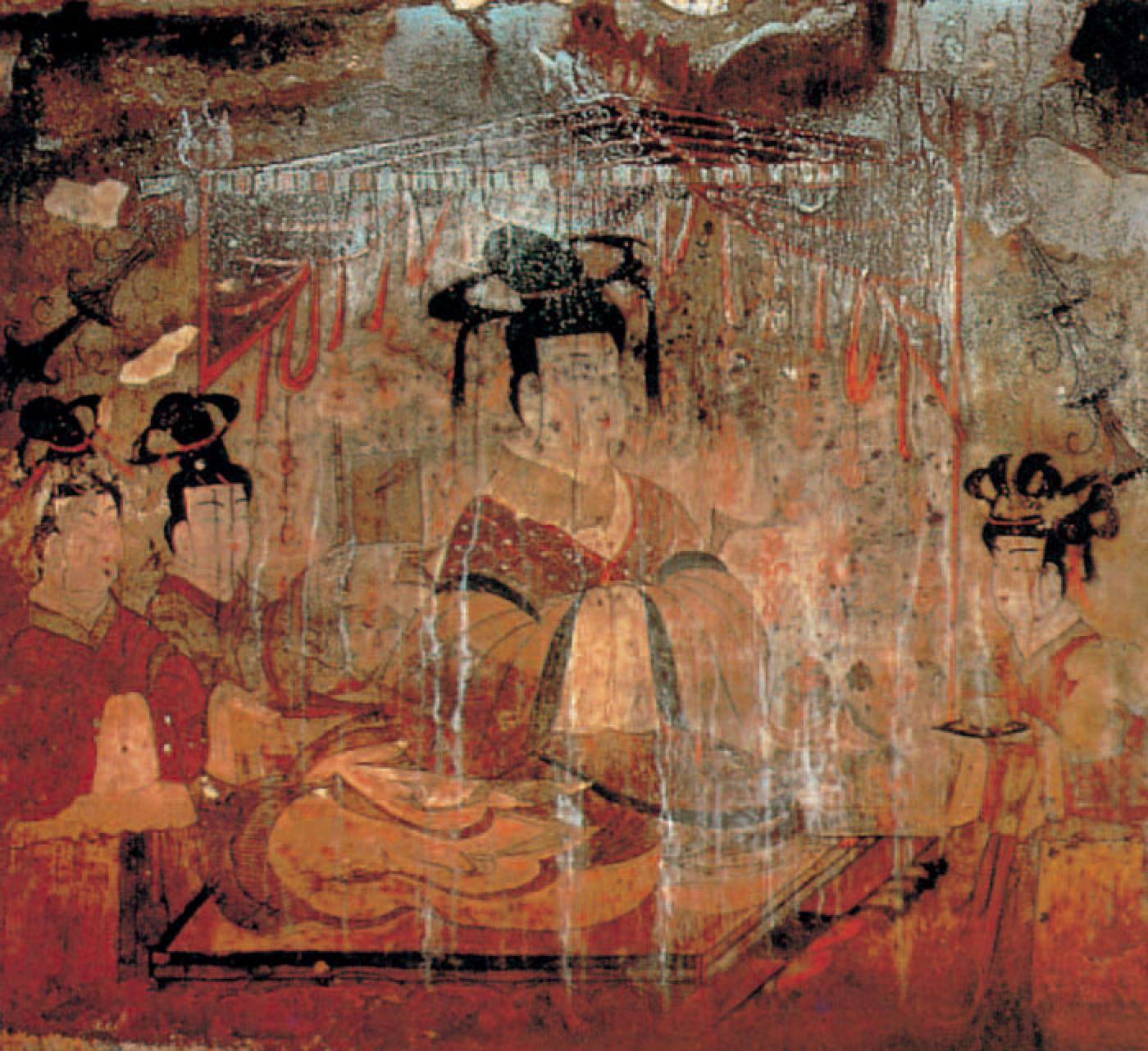 The wife of the tomb owner in Anak Tomb No. 3, seated in three-quarter view with attendants. She wears a robe with very wide sleeves and contrasting borders, and an enormous hairstyle of piled loops held with ornaments.