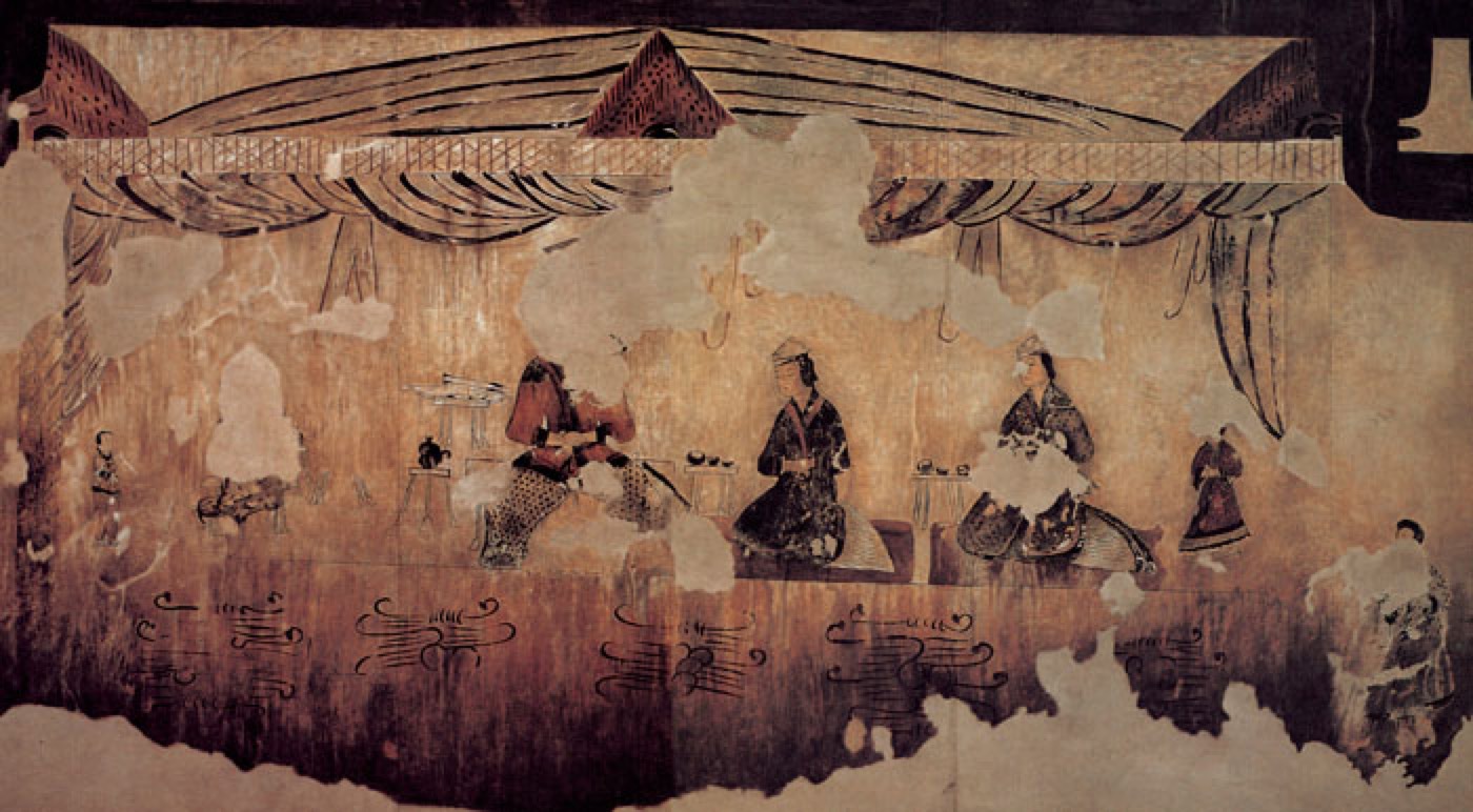 In a curtained room, the tomb owner sits with his two wives. He wears a jacket and wide trousers and the women wear long jackets over skirts, the basic two-piece dress of Goguryeo.