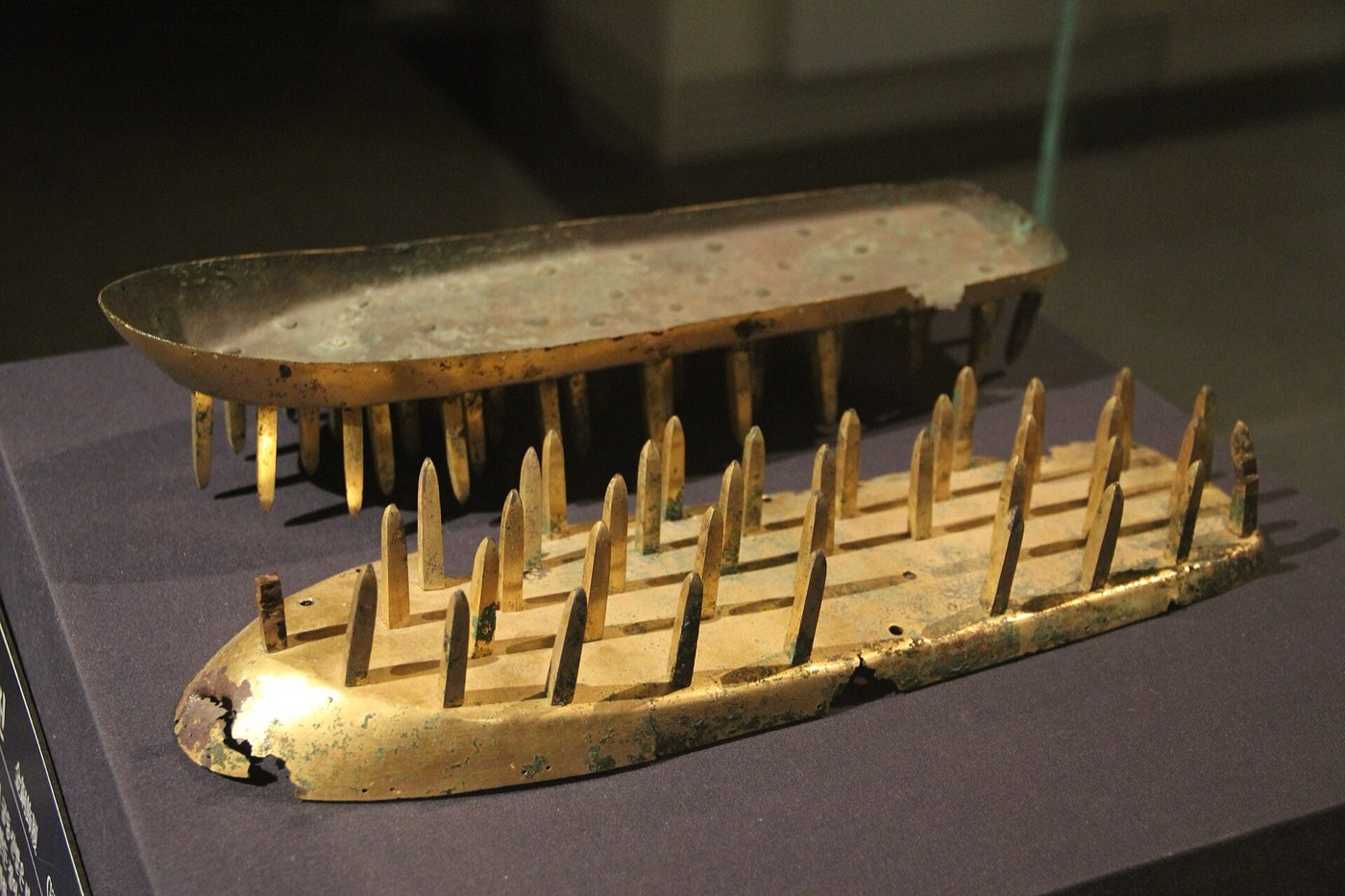 Gilt-bronze shoe soles set with rows of spikes, in the Goguryeo gallery of the National Museum of Korea. Spiked soles like these are known from Goguryeo tombs and were probably ceremonial or made for burial.
