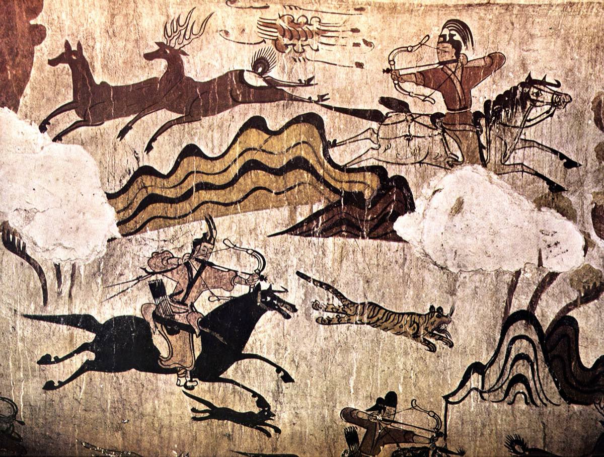 Mounted archers shoot deer and tigers in the famous hunting mural of Muyongchong (the Tomb of the Dancers) at Ji’an. The riders wear caps with long feathers, short belted jackets and trousers, and shoot backwards from the saddle.