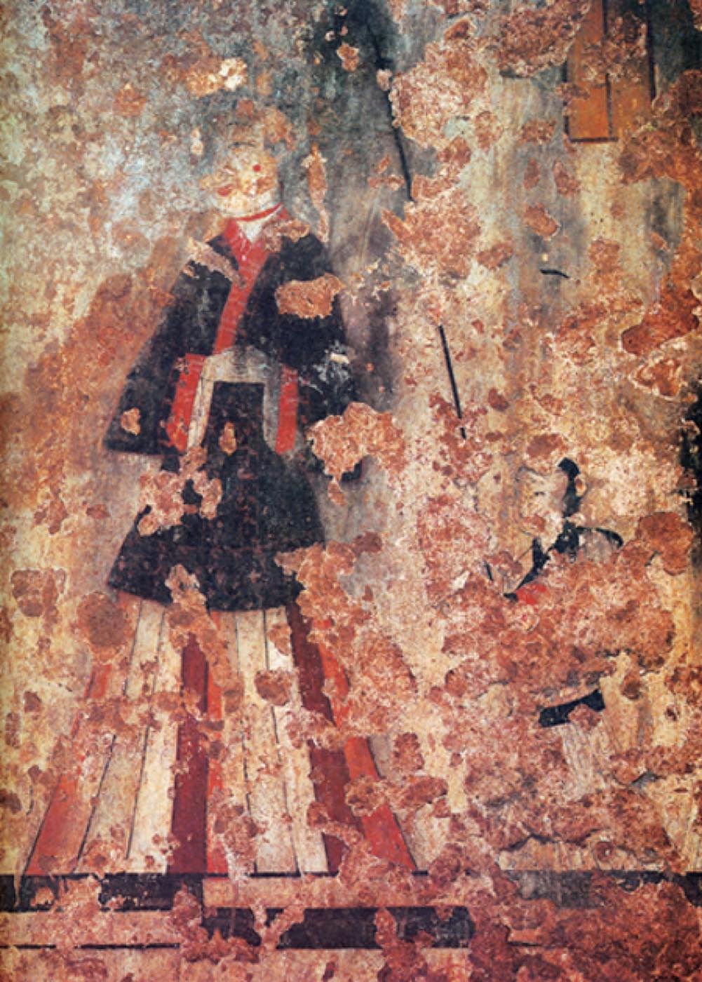 The noblewoman of the Susan-ri tomb mural, often compared with the women of Japan’s Takamatsuzuka tomb. She wears a jacket with red borders over a long pleated skirt with stripes, while an attendant follows her.