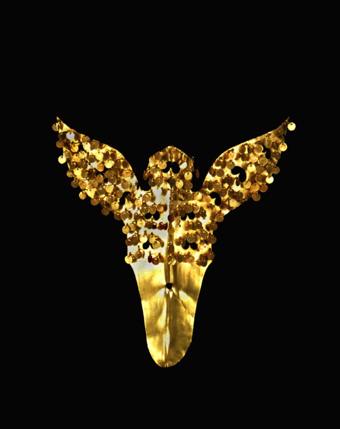 A second Cheonmachong gold cap ornament, with short spread wings like a butterfly or bird above a tongue-shaped base that slid into the cap. Spangles on the wings would tremble as the wearer moved.