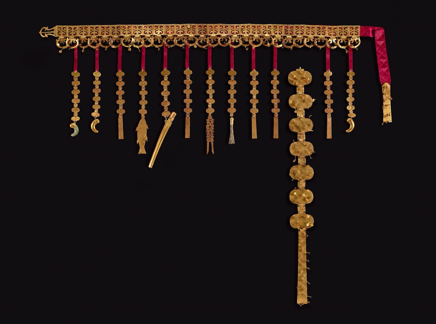 Gold belt from the woman’s mound of Hwangnam Daechong: openwork plaques on a leather band with long chains hanging from it, ending in miniature ornaments. It was worn with the gold crown as a full set of regalia.