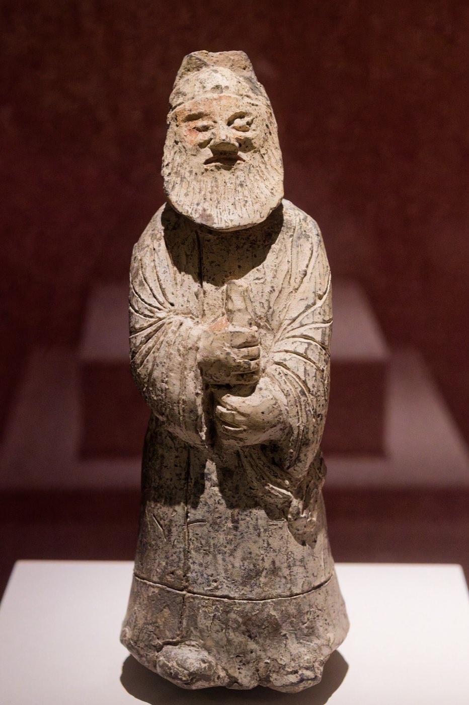 Bearded clay figurine from Hwangseong-dong, Gyeongju, with deep-set eyes and a large nose, wearing a cap and a long official’s robe. It is usually read as a man from Central Asia serving in Silla dress.