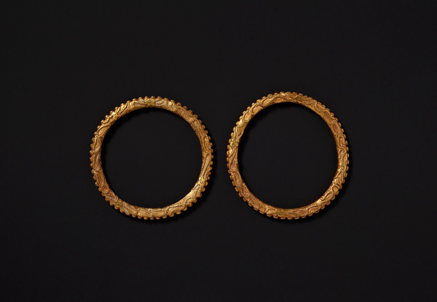 Pair of gold bracelets from Noseo-dong, Gyeongju, their outer edge raised in a row of small points. Silla nobles wore bracelets and rings on both arms, as burials with jewellery still in place show.