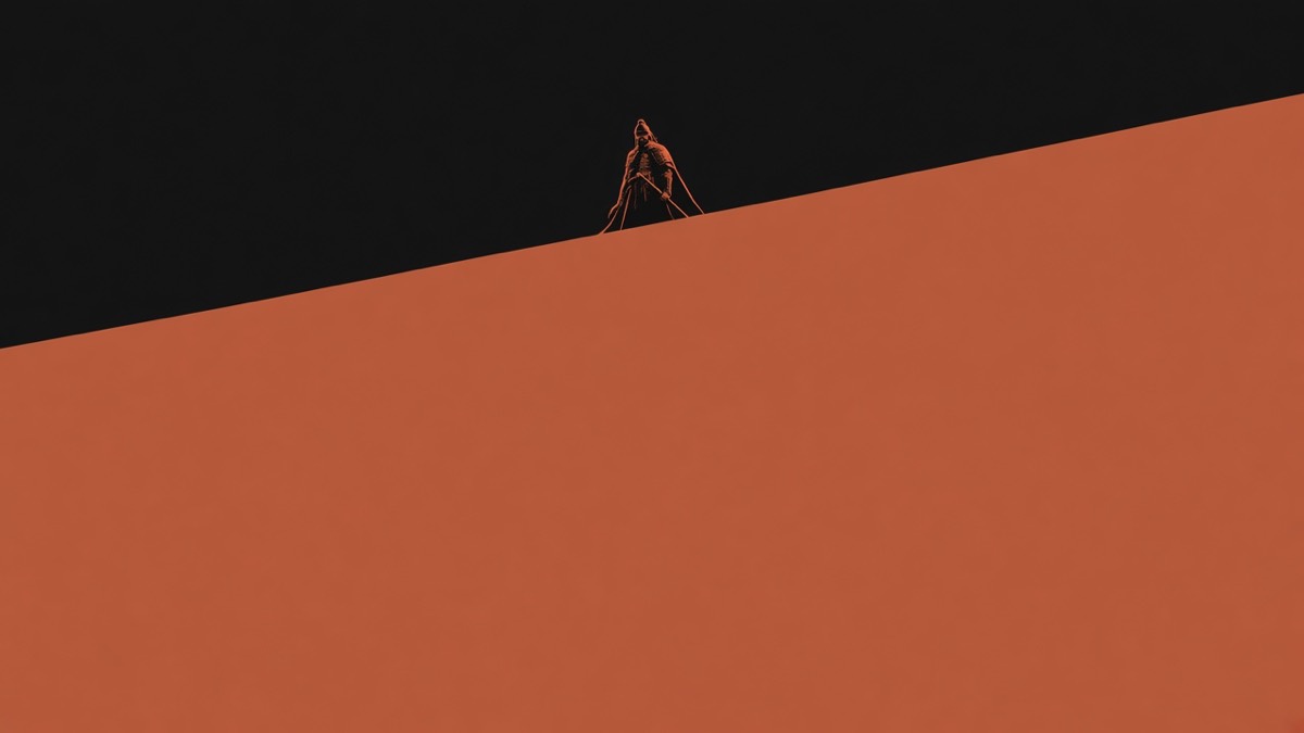 Worm’s-eye: Ansi’s wall as one hard terracotta plane; the Guardian of Ansi a tiny silhouette on the crown.